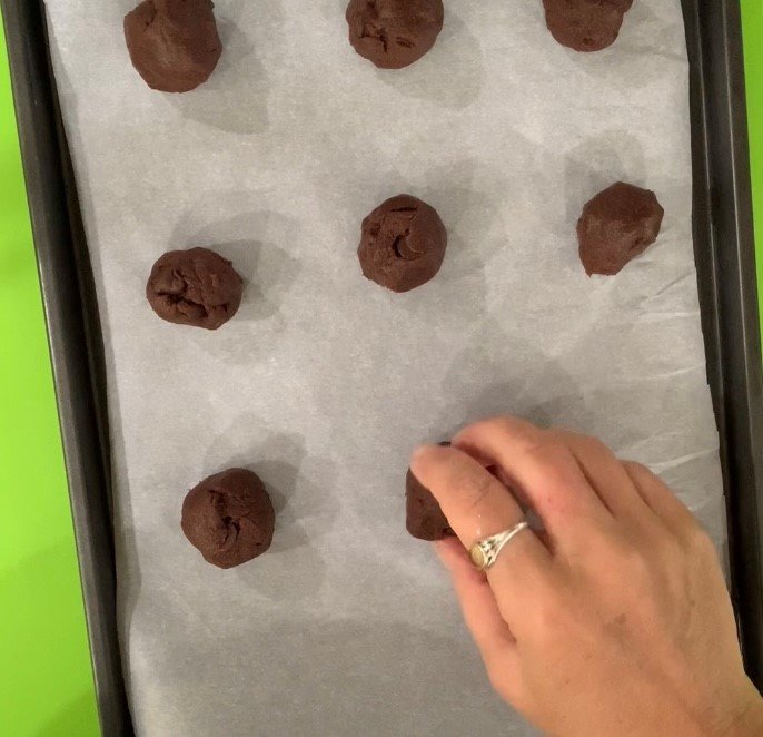 Roll the chilled dough into 1-inch balls. Place on cookie sheet and bake.